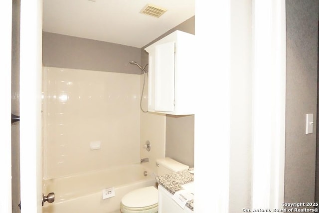 bathroom with shower / bath combination, vanity, visible vents, and toilet