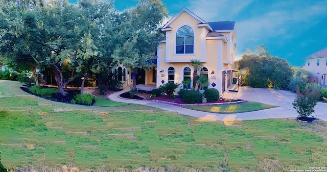 view of front of property with driveway and stucco siding