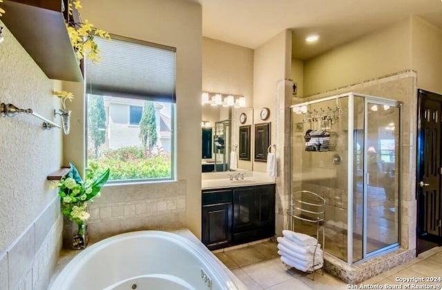 full bathroom with vanity, tile patterned floors, a whirlpool tub, and a stall shower