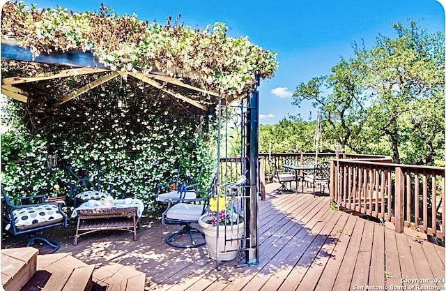 deck with outdoor dining area