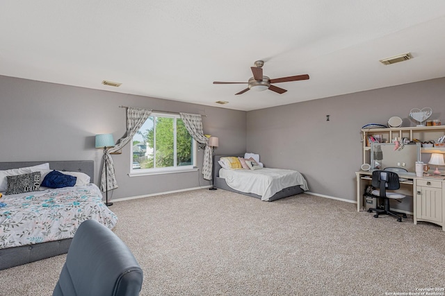 bedroom featuring baseboards, carpet flooring, and visible vents