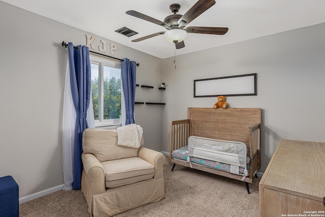 bedroom with baseboards, a ceiling fan, visible vents, and carpet flooring
