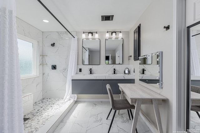 bathroom with visible vents, marble finish floor, double vanity, and tiled shower