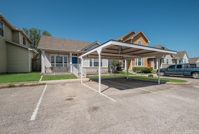 exterior space featuring covered and uncovered parking