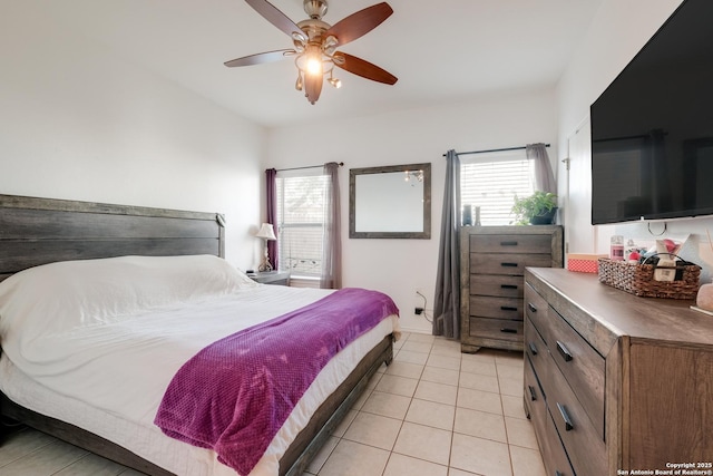 bedroom with a ceiling fan and light tile patterned floors