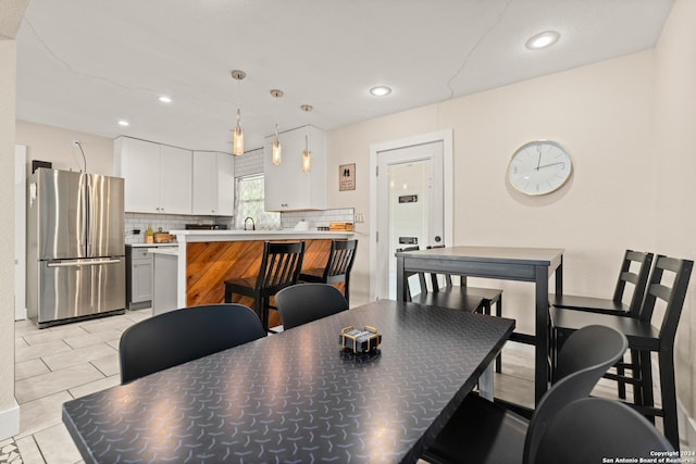 371 Sprucewood Ln, San Antonio, TX 78216 - dining room with light tile patterned flooring and recessed lighting