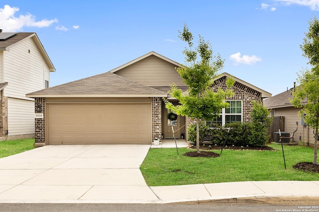 9928 Bratten Rise, San Antonio, TX 78254 - view of front of house featuring concrete driveway, an attached garage, central AC unit, brick siding, and a front lawn