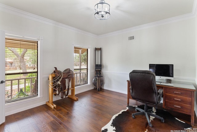 office space featuring visible vents, ornamental molding, and a healthy amount of sunlight