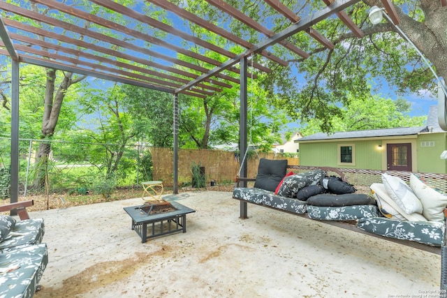 view of patio / terrace with fence, an outdoor living space with a fire pit, and a pergola