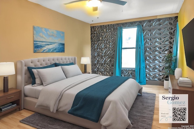 bedroom featuring light wood-style flooring and ceiling fan