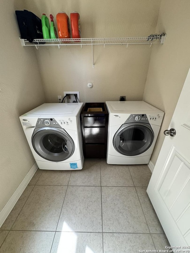9035 Monument Parke, San Antonio, TX 78254 - laundry room featuring baseboards, independent washer and dryer, laundry area, and light tile patterned floors