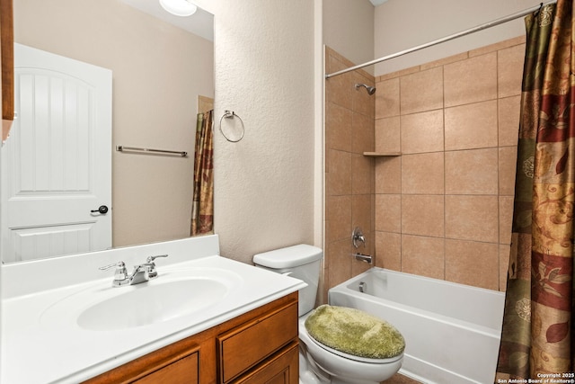 bathroom with shower / bath combination with curtain, toilet, a textured wall, and vanity