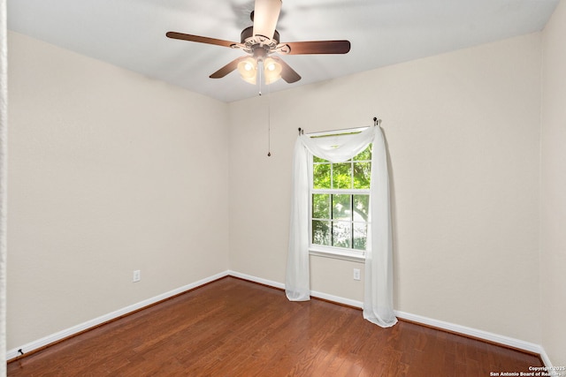 unfurnished room with wood finished floors, baseboards, and ceiling fan