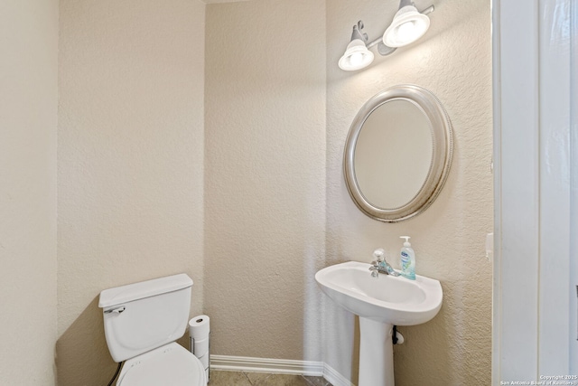 3329 Navasota Cir, San Antonio, TX 78259 - half bathroom with toilet and tile patterned floors
