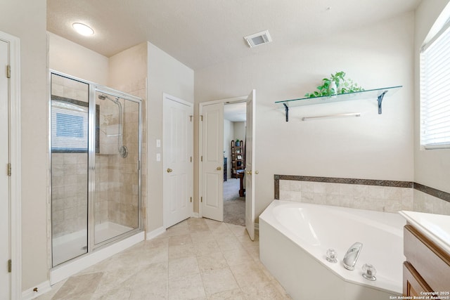 3329 Navasota Cir, San Antonio, TX 78259 - full bath with a stall shower, a bath, vanity, and tile patterned flooring