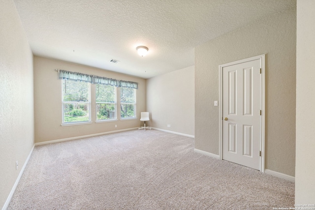 3329 Navasota Cir, San Antonio, TX 78259 - unfurnished room featuring carpet, a textured ceiling, and a textured wall