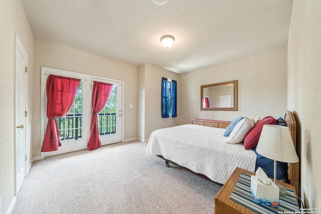 3329 Navasota Cir, San Antonio, TX 78259 - bedroom with access to outside, carpet, and a textured ceiling