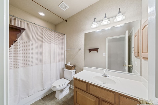 3329 Navasota Cir, San Antonio, TX 78259 - bathroom featuring a textured wall, vanity, and shower / tub combo with curtain