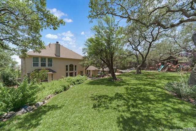 3329 Navasota Cir, San Antonio, TX 78259 - view of green lawn with a playground