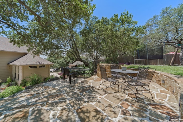 3329 Navasota Cir, San Antonio, TX 78259 - view of patio featuring outdoor dining area and a trampoline