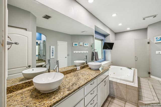 bathroom featuring a shower stall, visible vents, and a sink