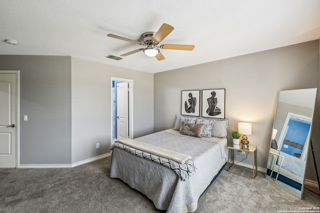 carpeted bedroom featuring visible vents, a ceiling fan, and baseboards