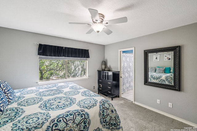 bedroom with ensuite bath, carpet floors, and ceiling fan