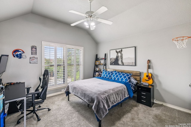 carpeted bedroom with vaulted ceiling, baseboards, and ceiling fan