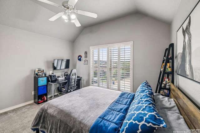 carpeted bedroom with vaulted ceiling, a ceiling fan, and baseboards
