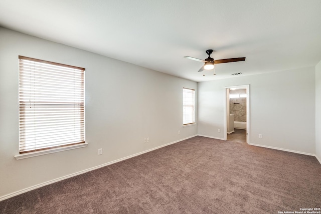 unfurnished room featuring carpet flooring, a ceiling fan, baseboards, and visible vents