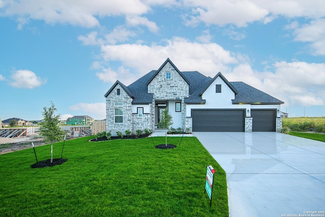view of front of house featuring driveway, stone siding, and a front yard