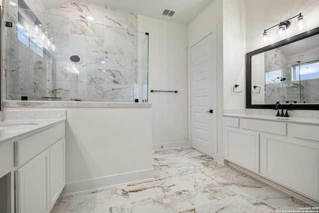 bathroom featuring two vanities, a marble finish shower, a sink, and visible vents