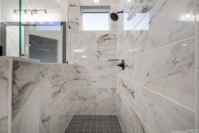 bathroom with a tile shower