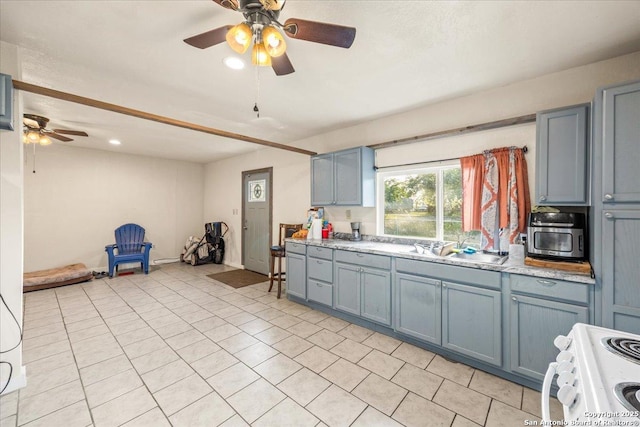 610 Novella, Adkins, TX 78101 - kitchen with white range with electric stovetop, light countertops, a ceiling fan, light tile patterned floors, and a sink
