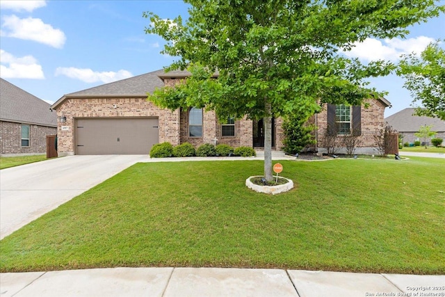 view of front of house featuring brick siding, driveway, a front lawn, and a garage