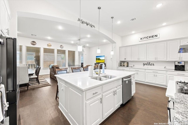 kitchen featuring recessed lighting, white cabinets, stainless steel appliances, and a sink