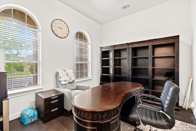 office area featuring visible vents, baseboards, and dark wood-style floors