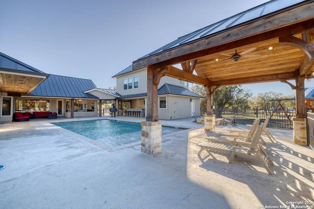 view of pool with fence, a patio, a fenced in pool, and ceiling fan