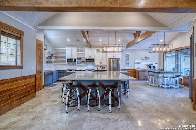 dining area with a notable chandelier, wood ceiling, lofted ceiling with beams, and finished concrete floors
