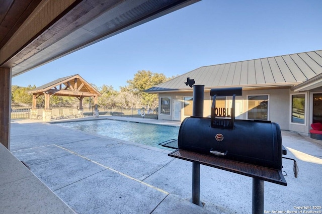 view of pool featuring fence, a fenced in pool, a gazebo, and a patio