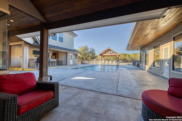 view of swimming pool with a fenced in pool, a gazebo, and a patio