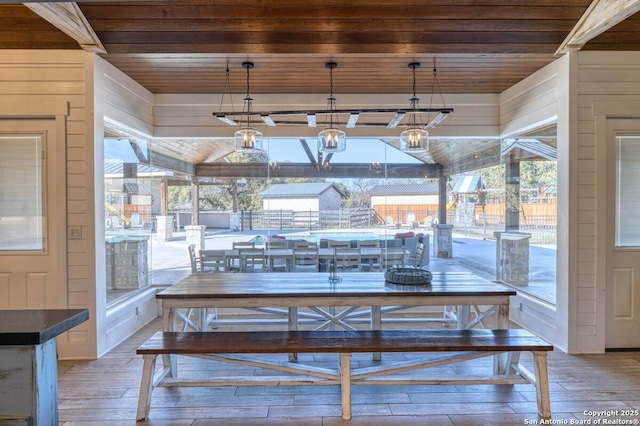 67 Stepping Stone, Concan, TX 78838 - dining area featuring light wood finished floors, wood walls, and wood ceiling