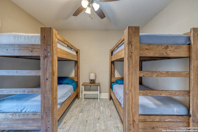 67 Stepping Stone, Concan, TX 78838 - bedroom with wood finished floors and ceiling fan