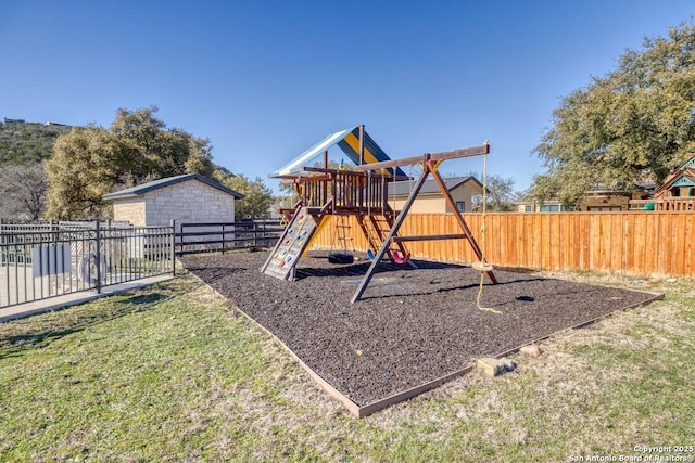 67 Stepping Stone, Concan, TX 78838 - view of jungle gym with a fenced backyard and a yard