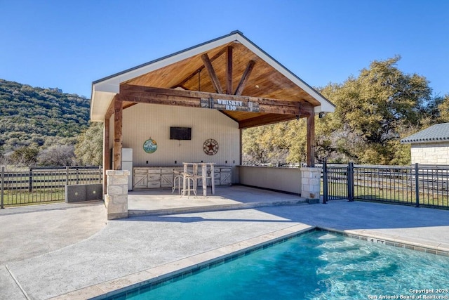 67 Stepping Stone, Concan, TX 78838 - view of pool featuring outdoor dry bar, fence, a patio, and a fenced in pool
