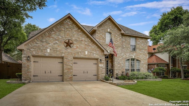 view of front of home featuring a garage, a front yard, roof with shingles, brick siding, and concrete driveway