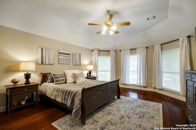 bedroom featuring baseboards, visible vents, ceiling fan, and hardwood / wood-style floors