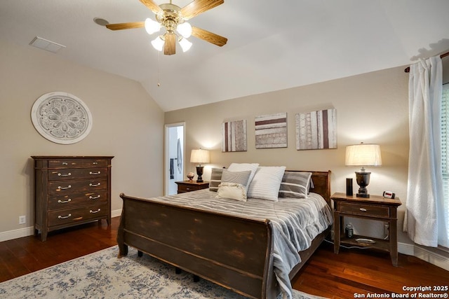 bedroom with visible vents, wood finished floors, baseboards, ceiling fan, and vaulted ceiling
