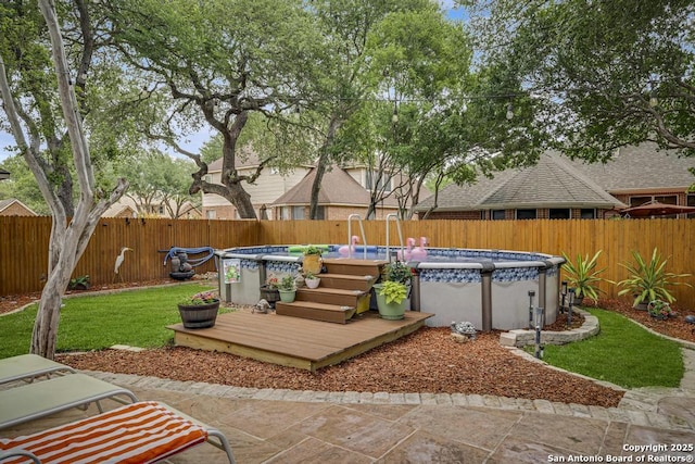 view of patio with a fenced in pool and a fenced backyard
