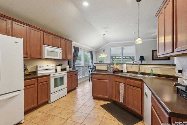 kitchen featuring dark countertops, vaulted ceiling, a sink, white appliances, and a peninsula